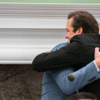 Dr. Ceglarek hugging speaker